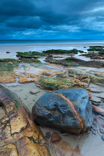 Rock on foreshore of beach, Moray, Scotland